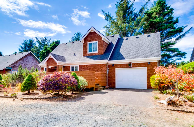 Freshly painted exterior of a craftsman-style home with a front porch